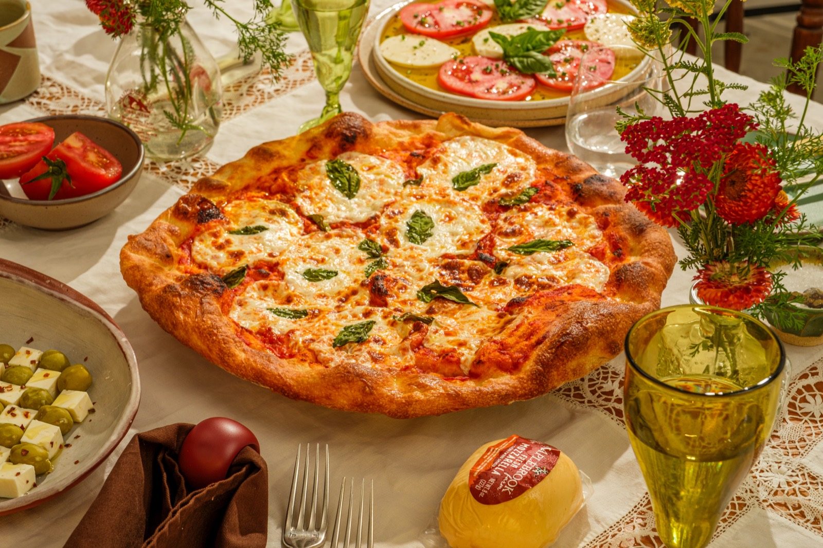 Pizza topped with fresh mozzarella and basil