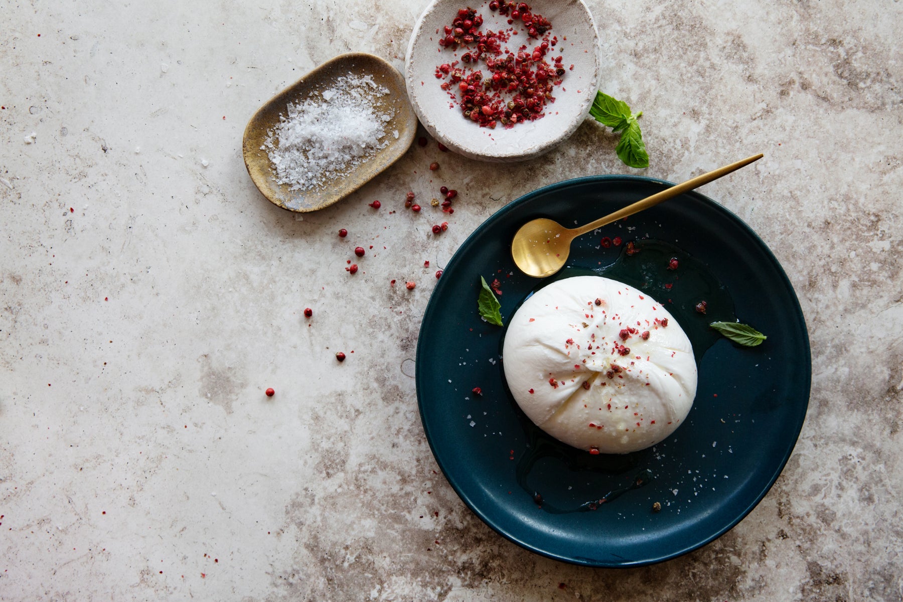 Maplebrook Farm burrata plated with tomatoes and basil